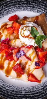 Strawberry crepes with whipped cream and caramel drizzled on a plate.