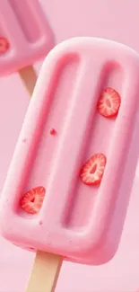 Pink strawberry popsicle wallpaper with fruit details.