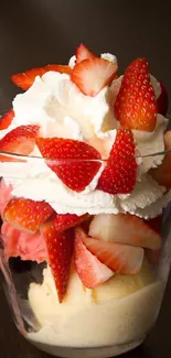 Close-up of a strawberry sundae with whipped cream.