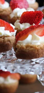 Strawberry desserts displayed elegantly on a crystal stand.