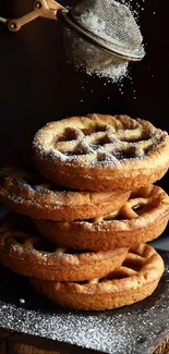 Stack of waffles with sugar dusting.