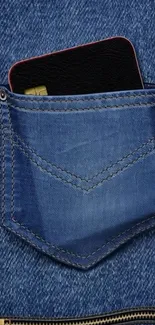 Smartphone in a blue denim jeans pocket wallpaper.