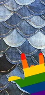 Denim scales pattern with rainbow hand.