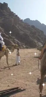 Camels and riders in a desert landscape.