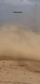 Car drifting in desert with dust clouds.