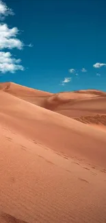 Mobile wallpaper of sandy desert dunes under a vibrant blue sky.