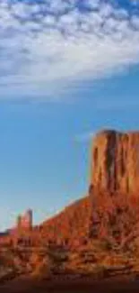 Stunning desert landscape with rock formations under a vivid blue sky.