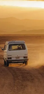 Retro van drives through golden desert landscape.