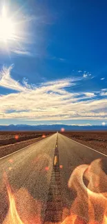 Sunlit desert road under a vibrant blue sky.