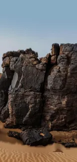 Desert rock formation under a clear sky.