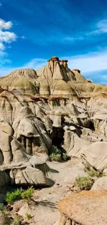 Desert rock formations under a vivid blue sky.