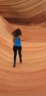 Woman exploring vibrant sandstone desert landscape.