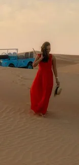 Woman in red dress walks in desert with vintage car.