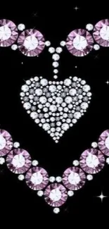 Mobile wallpaper with a sparkling gem heart design on a black background.