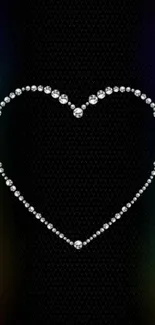Diamond heart with rainbow glow on black textured background.