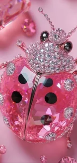 Sparkling pink diamond ladybug artwork on a phone wallpaper.
