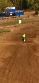 Dirt bike rider on a dusty track in outdoor adventure.