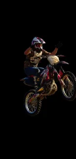 Dynamic dirt bike rider on a vibrant wallpaper.