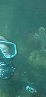 Diver explores underwater cross in teal ocean wallpaper.