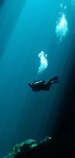 Scuba diver surrounded by deep ocean blue waters and bubbles.