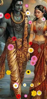 Divine couple in traditional attire surrounded by colorful flowers.