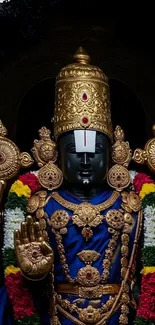 Divine statue in ornate attire with vibrant colors