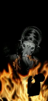 Ganesh silhouette with fiery background, symbolizing spirituality and power.