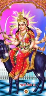 A vibrant Hindu goddess in traditional attire on mobile wallpaper.