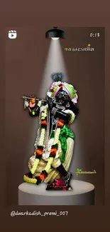 Divine Krishna statue with vibrant attire under spotlight