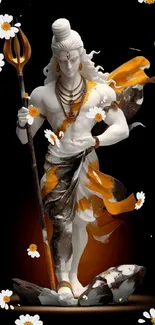 Statue of Lord Shiva with orange accents and white flowers on dark background.