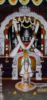 Vibrant Lord Shiva temple idol with floral garlands