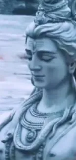 Serene depiction of Lord Shiva with flowing river behind.