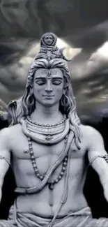 Monochrome image of Lord Shiva meditating under a dramatic sky.