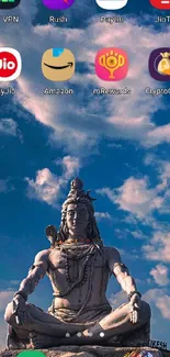 Shiva statue against a vibrant blue sky with scattered clouds on a mobile screen.