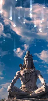 Lord Shiva statue under starry night sky with clouds.