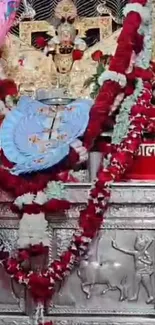 Ornate temple decoration with vibrant garlands and spiritual symbols.