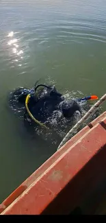 Elephant underwater with scuba gear in serene aquatic setting.