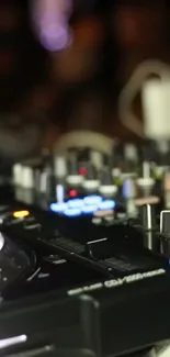 Close-up of a vibrant DJ console with colorful lights.