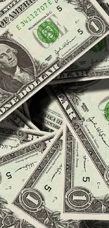 Scattered US dollar bills mobile phone wallpaper in green hue.