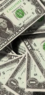 Stack of US dollar bills wallpaper with a green hue.