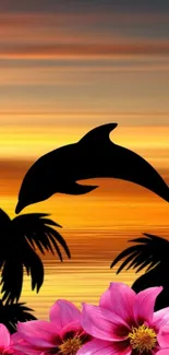 Silhouette of a dolphin at sunset with pink flowers and tropical palms.