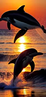 Two dolphins leap against a vibrant sunset over the ocean waves.