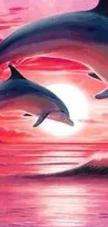 Two dolphins leap in a pink sunset over the ocean.