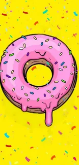 Pink frosted donut on a yellow background with colorful confetti.