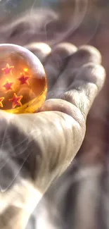 A hand holds a dragon ball with stars against a blurred background.