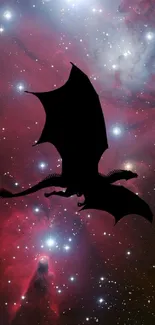 Dragon silhouette soaring across a vibrant nebula with stars.