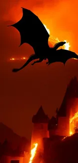 Silhouette of a dragon flying over a fiery castle.