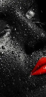 Close-up of a face with glossy black texture and vibrant red lips.