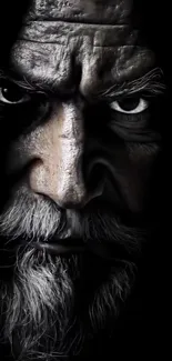 Dramatic black and white portrait of a man's face.