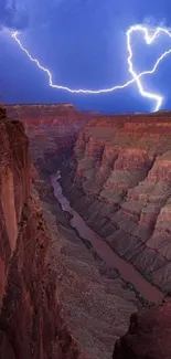 Canyon illuminated by lightning with a heart shape in the sky.